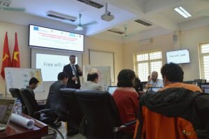 BioEcoN co-coordinator addressing team at meeting table